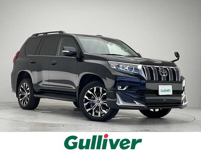 トヨタ ランドクルーザー プラド TX Lパッケージ 愛知県 2021(令3)年 3.1万km アティチュードブラックマイカ 衝突被害軽減ブレーキ/モデリスタエアロパーツ/純正9インチSDナビ（あり）/サンルーフ/レーダークルーズコントロール/シートヒーター/エアーシート/フルセグTV/CD DVD/Bluetooth/バックカメラ/パワーシート/コーナーセンサー/アルミホイール/ルーフレール/ETC2.0/4WD/LEDヘッドライト/ダウンヒルアシストコントロール/ドライブレコーダー/ステアリングスイッチ/スマートキー/プッシュスタート
