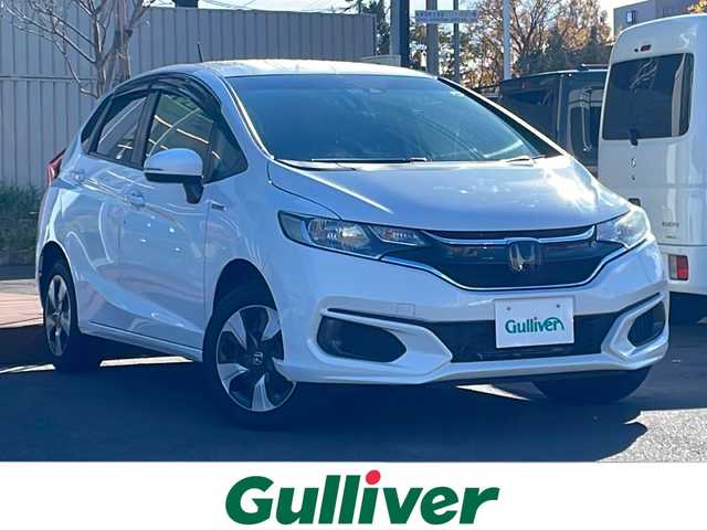 ホンダ フィット ハイブリット F 道央・札幌 2018(平30)年 8.8万km タフタホワイトⅢ ・4WD/・寒冷地仕様/・Gathersナビ　品番VXM-184Ci/（AM/FM/CD/BT）/・社外ETC/・衝突軽減ブレーキ/・クルーズコントロール（追従機能付）/・レーンキープアシスト/・フルオートエアコン/・ワイパーデアイサー/・ドアミラーウインカー/・ドアミラーヒーター/・電動格納ミラー/・冬タイヤ　15インチ積み込み（スチールホイール）/・ライトレベライザー/・盗難防止装置/・ABS/・横滑り防止装置/・プライバシーガラス/・スマートキー/・プッシュスタート/・スペアキー/・純正フロアマット/・IR/UVカットフロントウィンドウガラス/・IR/UVカットフロントドアガラス