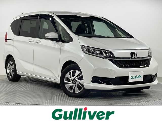 ホンダ フリード ハイブリット G 広島県 2023(令5)年 2.9万km プラチナホワイトパール 純正9型ナビ/両側パワースライドドア/バックカメラ/シートヒーター/ホンダセンシング/・衝突軽減ブレーキ/・レーンキープアシスト/・アダプティブクルーズコントロール/・誤発進抑制機能/LEDヘッドランプ/オートライト/ETC/ドライブレコーダー/USB入力端子