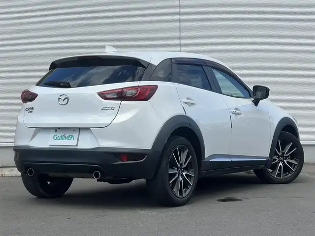 マツダ ＣＸ－３ XD ツーリング Lパッケージ 秋田県 2015(平27)年 9.5万km クリスタルホワイトパールマイカ ４WD/ターボ/衝突軽減システム/LEDヘッドライト/純正SDナビ/フルセグ/バックカメラ/マツダ純正18インチアルミ（夏タイヤ装着）/スマートキー/純正エンジンスターター/アイドリングストップ/プッシュスタート/クルーズコントロール追従走行有/レーンキープアシスト/オートマチックハイビーム/AFS（アダプティブ・フロントライティング・システム）/MTモード付AT/ステアリングスイッチ/パドルシフト/ブラインドスポットモニター/前席シートヒーター/ETC/純正フロアマット/純正ドアバイザー/オートライト/オートエアコン/パワーステアリング/パワーウィンドウ/横滑り防止/盗難防止装置/寒冷地仕様/電動格納ウィンカーミラー/キーレスエントリー/保証書/取扱説明書/記録簿/スペアキー1本有
