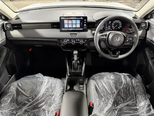ホンダ ヴェゼル ハイブリッド e:HEV Z 大阪府 2025(令7)年 0.1千km プラチナホワイトパール 登録済未使用車 純正9incナビTV バックカメラ ハーフレザー シート＆ハンドルヒーター 電動リアゲート レーダークルコン 衝突軽減ブレーキ レーンアシスト ブラインドSM ダウンヒルアシスト 置き型充電