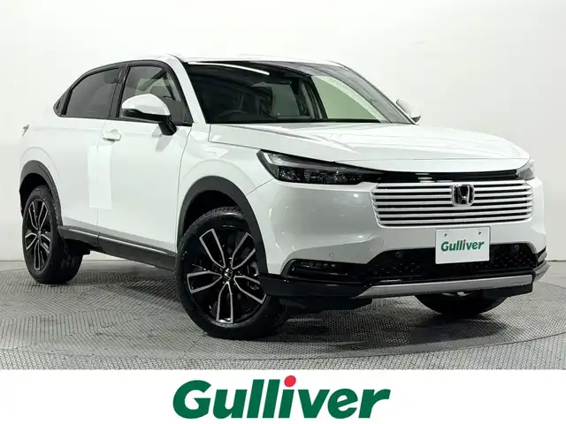 ホンダ ヴェゼル ハイブリッド e:HEV Z 大阪府 2025(令7)年 0.1千km プラチナホワイトパール 登録済未使用車 純正9incナビTV バックカメラ ハーフレザー シート＆ハンドルヒーター 電動リアゲート レーダークルコン 衝突軽減ブレーキ レーンアシスト ブラインドSM ダウンヒルアシスト 置き型充電