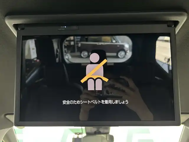 トヨタ ヴォクシー ハイブリッド S－Z 鹿児島県 2024(令6)年 1万km アティチュードブラックマイカ 純正ディスプレイオーディオ/バックカメラ/トヨタセーフティセンス/・プリクラッシュセーフティ/・レーントレーシングアシスト/・レーンディパーチャーアラート/・全車速追従機能付レーダークルーズコントロール/・オートマチックハイビーム/・ロードサインアシスト/・発進遅れ告知機能/純正フリップダウンモニター【V14T-R72R】/革巻きステアリング/ステアリングヒーター/ステアリングリモコン/純正ＬＥＤヘッドライト/オートライト/パワーバックドア/ＥＴＣ２．０　/社外前後ドライブレコーダー【TZ-D215W】/ハーフレザーシート/前席シートヒーター/両側パワースライドドア/AC100V/フロント&バックソナー/純正フロアマット/純正17インチアルミ