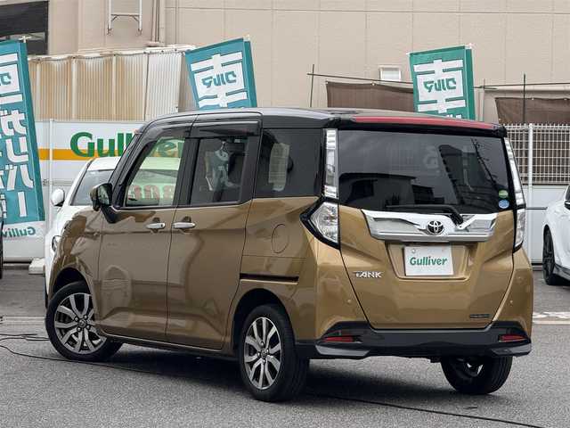 トヨタ タンク カスタムG－T 愛知県 2017(平29)年 9.5万km ブラックマイカメタリック/インペリアルゴールドクリスタルメタリック 2トーン /禁煙車//純正9インチナビ//フルセグ/CD/DVD/SD/Bluetooth/MSV/ラジオ//ステアリング連動バックカメラ//ビルトインETC//ドライブレコーダー//両側パワースライドドア//シートヒーター//クルーズコントロール//スマートアシストII//衝突回避支援ブレーキ機能//衝突警報機能//誤発進抑制制御機能//後方誤発進抑制制御機能//車線逸脱警報//先行車発進お知らせ機能//LEDオートヘッドライト//フォグランプ//リアロールサンシェード//シートバックテーブル//プッシュスタート//スペアスマートキー//純正15インチアルミホイール//スペアタイヤ//TRC//SPORTモード//アイドリングストップ//オートリトラクタブルウィンカーミラー//純正フロアマット//純正ドアバイザー//革巻きステアリング//ステアリングリモコン//チルトハンドル//シートリフター//保証書//取扱説明書//ナビ取扱説明書//点検整備記録簿H29.30.31.R2