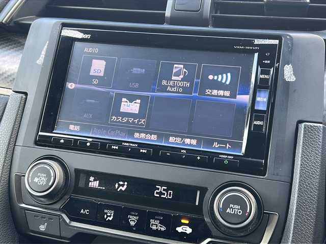 ホンダ シビック ハッチバック 広島県 2018(平30)年 5万km クリスタルブラックパール Honda SENSING/・衝突軽減ブレーキ〈CMBS〉/・渋滞追従機能付アダプティブ・クルーズ・コントロール/・LKAS〈車線維持支援システム〉/・路外逸脱抑制機能/・オートハイビーム/・標識認識機能/アジャイルハンドリングアシスト/純正ナビ（VXM-195VFi）/・フルセグ/CD/DVD/Bluetooth/SD/バックカメラ/革巻きステアリング/ステアリングスイッチ/パドルシフト/オートライト/シートヒーター/電動パーキングブレーキ/ブレーキホールド/スマートキー/プッシュスタート/ユピテルドライブレコーダー/ETC/ピアノブラック・フロントグリル/フロントスポイラー/純正１８インチアルミホイール/W+サイド+カーテンエアバック