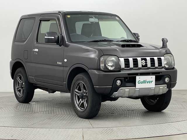スズキ ジムニー クロスアドベンチャー 新潟県 2012(平24)年 8.1万km クエーサーグレーメタリック ４WD/ターボ/リモコンキー/メモリナビ　型式AVN-G02/CD/DVD/フルセグ/レザーシート/フォグ/スタッドレスタイヤ4本積載