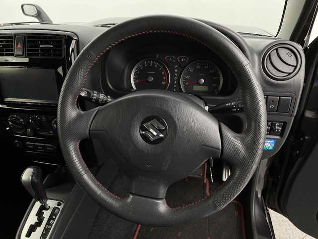 スズキ ジムニー クロスアドベンチャー 新潟県 2012(平24)年 8.1万km クエーサーグレーメタリック ４WD/ターボ/リモコンキー/メモリナビ　型式AVN-G02/CD/DVD/フルセグ/レザーシート/フォグ/スタッドレスタイヤ4本積載