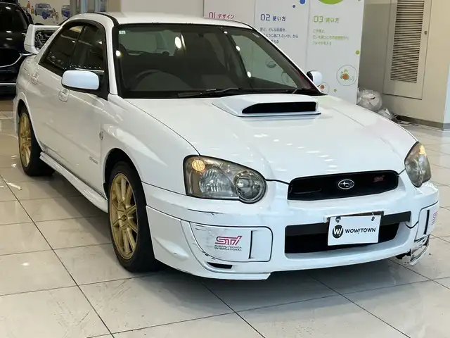スバル インプレッサ ＷＲＸ STi 埼玉県 2004(平16)年 10.7万km パール 純正エアロ　/ＭＤ再生／ＣＤ再生　/純正１７インチアルミホイール　/純正フロアマット　/ハロゲンライト　/リモコンキー　/保証書/取扱説明書/禁煙車
