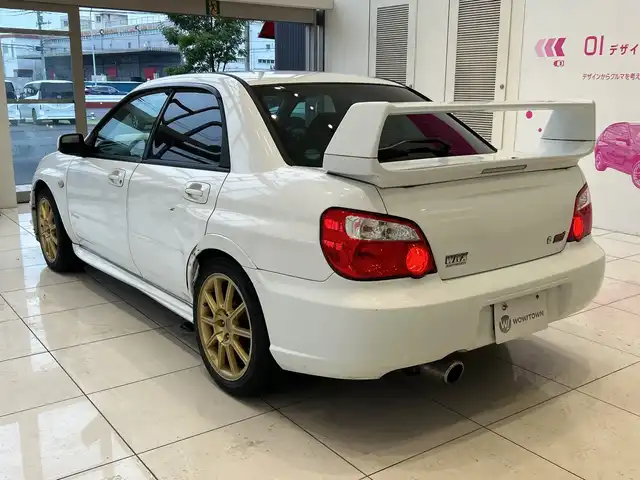 スバル インプレッサ ＷＲＸ STi 埼玉県 2004(平16)年 10.7万km パール 純正エアロ　/ＭＤ再生／ＣＤ再生　/純正１７インチアルミホイール　/純正フロアマット　/ハロゲンライト　/リモコンキー　/保証書/取扱説明書/禁煙車