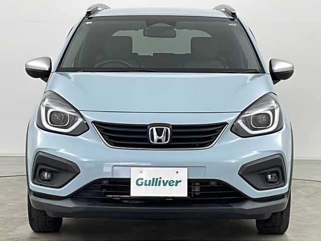 ホンダ フィット e:HEVクロスター 道央・札幌 2020(令2)年 6.3万km サーフブルー ・4WD/・寒冷地仕様/・純正ナビ&BT&TV&CD&DVD/・バックカメラ/・Honda　SENSING/・衝突軽減ブレーキ/・誤発進抑制機能/・路外逸脱抑制機能/・ACC/・車線維持支援システム/・先行車発進お知らせ/・標識認識機能/・オートハイビーム/・前後コーナーセンサー/・ルーフレール/・ステアリングスイッチ/・ドアミラーヒーター/・LEDヘッドライト/・フォグランプ/・オートライト/・スマートキー/・ETC/・純正16インチAW