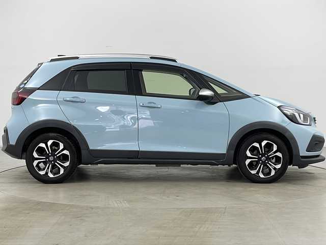 ホンダ フィット e:HEVクロスター 道央・札幌 2020(令2)年 6.3万km サーフブルー ・4WD/・寒冷地仕様/・純正ナビ&BT&TV&CD&DVD/・バックカメラ/・Honda　SENSING/・衝突軽減ブレーキ/・誤発進抑制機能/・路外逸脱抑制機能/・ACC/・車線維持支援システム/・先行車発進お知らせ/・標識認識機能/・オートハイビーム/・前後コーナーセンサー/・ルーフレール/・ステアリングスイッチ/・ドアミラーヒーター/・LEDヘッドライト/・フォグランプ/・オートライト/・スマートキー/・ETC/・純正16インチAW