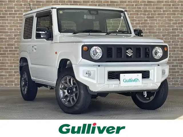 スズキ ジムニー XC 岩手県 2023(令5)年 1.4万km ピュアホワイトP ワンオーナー/パートタイム４WD/ターボ/スズキセーフティサポート/デュアルセンサーブレーキサポート/車線逸脱警報/誤発進抑制機能/ハイビームアシスト/先行車発信お知らせ機能/標識認識機能/クルーズコントロール/ヒルディセントコントロール/ヒルホールドアシスト/ブレーキLSDトラクションコントロール/横滑り防止装置/アイドリングストップ/社外テールレンズ/ミラー型ドライブレコーダー/オートエアコン/ヒーター付きドアミラー/LEDヘッドライト/LEDフォグライト/純正16インチアルミホイール/純正ゴムマット