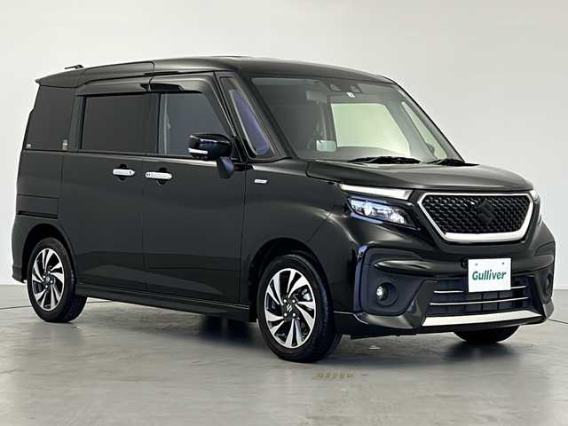 スズキ ソリオ バンディット HV MV 岐阜県 2022(令4)年 0.6万km スーパーブラックパール 社外ナビ/BT/フルセグ/CD/DVD/USB/SD/衝突被害軽減システム/追従型クルーズコントロール/レーンキープアシスト/全方位カメラ/コーナーセンサー後方/両側パワースライドドア/シートヒーター（運転席/助手席）/ETC2.0/スマートキー/プッシュスタート/スペアキー/オートハイビーム/LEDヘッドライト/フォグランプ/オートライト/革ステアリング/ステアリングスイッチ/純正アルミホイール/純正ドアバイザー