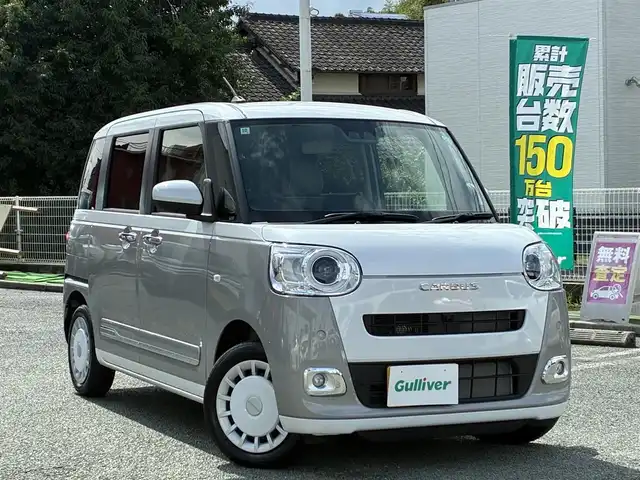 ダイハツ ムーヴ キャンバス ストライプス G 熊本県 2024(令6)年 0.5万km シャイニングホワイトパール/スムーズグレーマイカメタリック ワンオーナー/ディスプレイオーディオ/【CD/DVD/BT/AUX/USB】/全方位カメラ/衝突軽減ブレーキ/車線逸脱警報/パーキングセンサー/両側パワースライドドア/シートヒーター/ステアリングリモコン/アイドリングストップ/ＬＥＤオートライト/フォグランプ/電格式ミラー/社外フロアマット/電子パーキング/オートホールド/スマートキー/スペアキー/取扱説明書/保証書