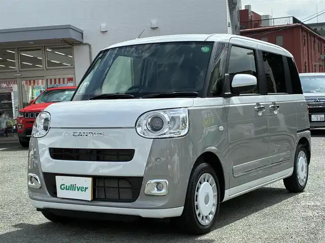 ダイハツ ムーヴ キャンバス ストライプス G 熊本県 2024(令6)年 0.5万km シャイニングホワイトパール/スムーズグレーマイカメタリック ワンオーナー/ディスプレイオーディオ/【CD/DVD/BT/AUX/USB】/全方位カメラ/衝突軽減ブレーキ/車線逸脱警報/パーキングセンサー/両側パワースライドドア/シートヒーター/ステアリングリモコン/アイドリングストップ/ＬＥＤオートライト/フォグランプ/電格式ミラー/社外フロアマット/電子パーキング/オートホールド/スマートキー/スペアキー/取扱説明書/保証書