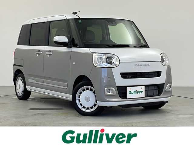 ダイハツ ムーヴ キャンバス ストライプス G 愛知県 2024(令6)年 0.5万km シャイニングホワイトパール/スムーズグレーマイカメタリック ワンオーナー/ディスプレイオーディオ/【CD/DVD/BT/AUX/USB】/全方位カメラ/衝突軽減ブレーキ/車線逸脱警報/パーキングセンサー/両側パワースライドドア/シートヒーター/ステアリングリモコン/アイドリングストップ/ＬＥＤオートライト/フォグランプ/電格式ミラー/社外フロアマット/電子パーキング/オートホールド/スマートキー/スペアキー/取扱説明書/保証書