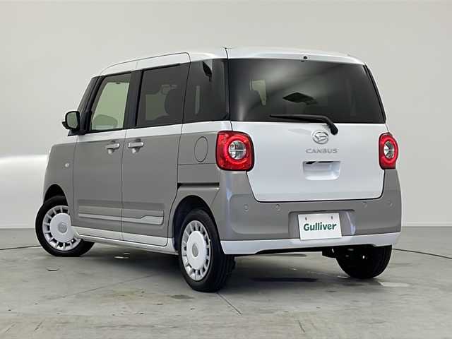 ダイハツ ムーヴ キャンバス ストライプス G 愛知県 2024(令6)年 0.5万km シャイニングホワイトパール/スムーズグレーマイカメタリック ワンオーナー/ディスプレイオーディオ/【CD/DVD/BT/AUX/USB】/全方位カメラ/衝突軽減ブレーキ/車線逸脱警報/パーキングセンサー/両側パワースライドドア/シートヒーター/ステアリングリモコン/アイドリングストップ/ＬＥＤオートライト/フォグランプ/電格式ミラー/社外フロアマット/電子パーキング/オートホールド/スマートキー/スペアキー/取扱説明書/保証書