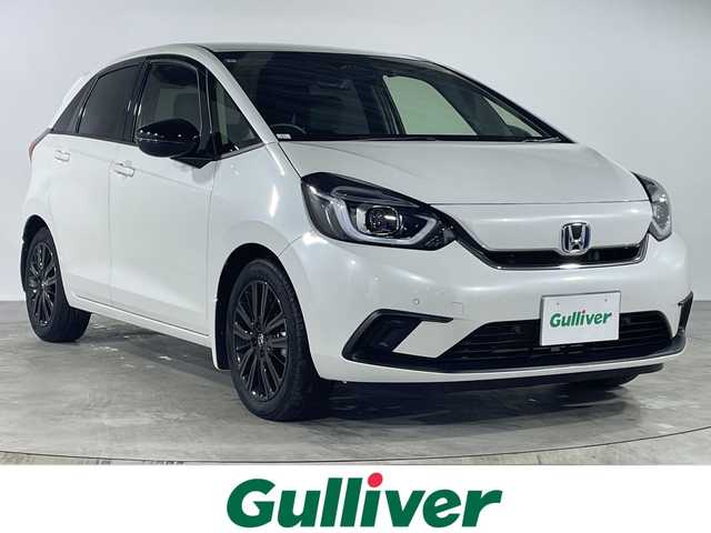 ホンダ フィット e:HEVホーム カーサ 福岡県 2022(令4)年 0.6万km プラチナホワイトパール ・純正9インチインチプレミアムインターナビ/・ナビフルセグＴＶ　ＤＶＤ　ＢＴ　ＳＤ　/・バックカメラ　/・ＥＴＣ２．０　/・前後ドライブレコーダー　/・カーサ専用ハーフレザーシート　/・専用フロアマット　/・シートヒーター　　/・レーダークルーズコントロール　/・スマートキー×２/・プッシュスタート/・オートライト/・LEDヘットライト/・純正16インチアルミ/・ホンダセンシング/・路外逸脱抑制/・踏み間違い衝突軽減システム/・衝突軽減ブレーキ/・保証書/・取説
