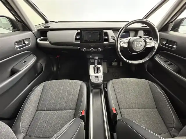 ホンダ フィット e:HEVホーム 道央・札幌 2021(令3)年 5.6万km プラチナホワイトパール ・４WD/・寒冷地仕様/・ホンダセンシング/・衝突被害軽減ブレーキ/・レーンキープアシスト/・踏み間違え防止装置/・レーダークルーズコントロール/・コーナーセンサー/・フロントワイパーデアイサー/・ミラーヒーター/・社外メモリナビ/・バクカメラ/・電子パーキング/・ETC/・スマートキー/・プッシュスタート/・横滑り防止装置/・LEDヘッドライト/・電格ミラー