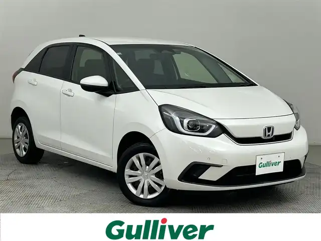 ホンダ フィット e:HEVホーム 道央・札幌 2021(令3)年 5.6万km プラチナホワイトパール ・４WD/・寒冷地仕様/・ホンダセンシング/・衝突被害軽減ブレーキ/・レーンキープアシスト/・踏み間違え防止装置/・レーダークルーズコントロール/・コーナーセンサー/・フロントワイパーデアイサー/・ミラーヒーター/・社外メモリナビ/・バクカメラ/・電子パーキング/・ETC/・スマートキー/・プッシュスタート/・横滑り防止装置/・LEDヘッドライト/・電格ミラー