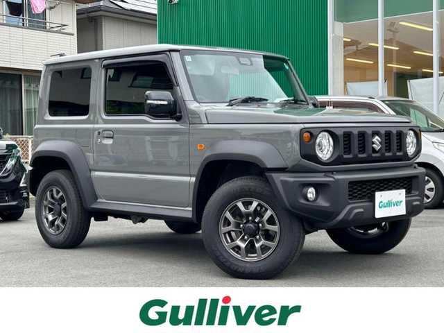 スズキ ジムニー シエラ JC 静岡県 2024(令6)年 0.3万km ミディアムグレー エンジンスタートボタン/ワンオーナー/パワーステアリング/パワーウィンドウ/4WD/アイドリングストップ/スマートキー/オートエアコン/クルーズコントロール/CD/CDチェンジャー/純正フロアマット/純正アルミホイール/D席N席シートヒーター/背面タイヤ/ABS/横滑り防止装置/コーナーセンサー後/センターデフロック/レーンキープアシスト/オートライト/LEDライト/オートマチックハイビーム/ダウンヒルアシストコントロール/W+サイドエアバック/衝突軽減システム