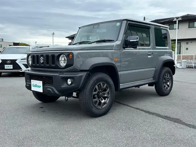 スズキ ジムニー シエラ JC 静岡県 2024(令6)年 0.3万km ミディアムグレー エンジンスタートボタン/ワンオーナー/パワーステアリング/パワーウィンドウ/4WD/アイドリングストップ/スマートキー/オートエアコン/クルーズコントロール/CD/CDチェンジャー/純正フロアマット/純正アルミホイール/D席N席シートヒーター/背面タイヤ/ABS/横滑り防止装置/コーナーセンサー後/センターデフロック/レーンキープアシスト/オートライト/LEDライト/オートマチックハイビーム/ダウンヒルアシストコントロール/W+サイドエアバック/衝突軽減システム