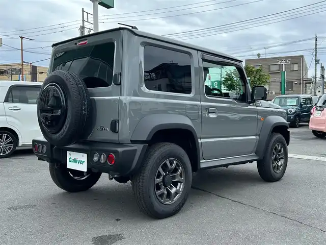 スズキ ジムニー シエラ JC 静岡県 2024(令6)年 0.3万km ミディアムグレー エンジンスタートボタン/ワンオーナー/パワーステアリング/パワーウィンドウ/4WD/アイドリングストップ/スマートキー/オートエアコン/クルーズコントロール/CD/CDチェンジャー/純正フロアマット/純正アルミホイール/D席N席シートヒーター/背面タイヤ/ABS/横滑り防止装置/コーナーセンサー後/センターデフロック/レーンキープアシスト/オートライト/LEDライト/オートマチックハイビーム/ダウンヒルアシストコントロール/W+サイドエアバック/衝突軽減システム