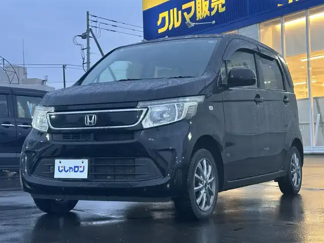 ホンダ Ｎ ＷＧＮ G 道北・旭川 2015(平27)年 4.8万km スマートブラック (株)IDOMが運営する【じしゃロン旭川店】の自社ローン対象車両になります。こちらは現金ご利用時の価格です。/自社ローンご希望の方は別途その旨お申付け下さい/　/・純正ナビ(CD/DVD/BT/SD/フルセグ)/・両席シートヒーター/・アイドリングストップ/・横滑り防止装置/・電動格納ミラー/・ワイパーデアイサー/・リアデフォッガー/・プッシュスタート/・スマートキー2個/・現車装着 社外AW165/65R14/・積込スタッドレス SW165/65R14