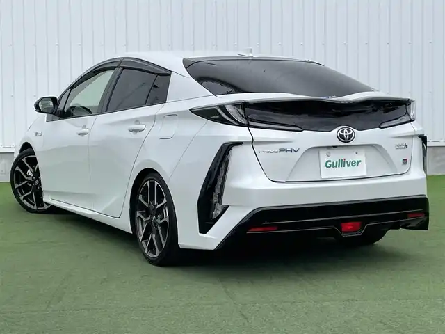 トヨタ プリウス ＰＨＶ S GRスポーツ 香川県 2021(令3)年 3.1万km プラチナホワイトパールマイカ 登録時走行距離：30713km/ケンウッド9型ナビゲーション/→CD/DVD/BT/→フルセグTV/バックカメラ/ドライブレコーダー/ETC/AC100V/ビルシュタイン車高調/プリクラッシュセーフティ/レーンキープアシスト/レーダークルーズコントロール/オートハイビーム/LEDオートヘッドライト/フォグランプ/リアフォグランプ/ステアリングリモコン/革巻きステアリング/横滑り防止装置/シートヒーター/ハーフレザーシート/プッシュスタート/スマートキー