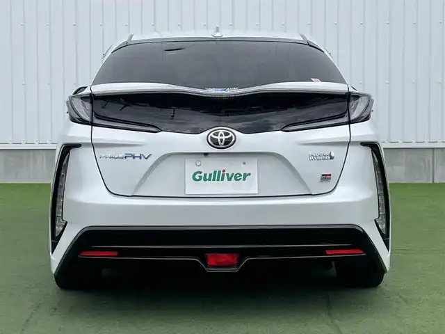 トヨタ プリウス ＰＨＶ S GRスポーツ 香川県 2021(令3)年 3.1万km プラチナホワイトパールマイカ 登録時走行距離：30713km/ケンウッド9型ナビゲーション/→CD/DVD/BT/→フルセグTV/バックカメラ/ドライブレコーダー/ETC/AC100V/ビルシュタイン車高調/プリクラッシュセーフティ/レーンキープアシスト/レーダークルーズコントロール/オートハイビーム/LEDオートヘッドライト/フォグランプ/リアフォグランプ/ステアリングリモコン/革巻きステアリング/横滑り防止装置/シートヒーター/ハーフレザーシート/プッシュスタート/スマートキー