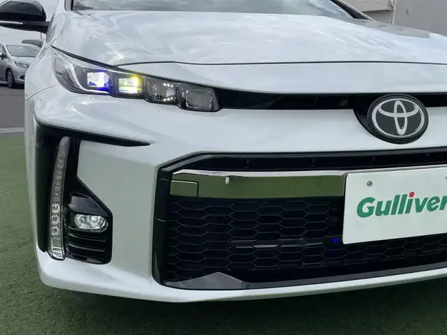 トヨタ プリウス ＰＨＶ S GRスポーツ 香川県 2021(令3)年 3.1万km プラチナホワイトパールマイカ 登録時走行距離：30713km/ケンウッド9型ナビゲーション/→CD/DVD/BT/→フルセグTV/バックカメラ/ドライブレコーダー/ETC/AC100V/ビルシュタイン車高調/プリクラッシュセーフティ/レーンキープアシスト/レーダークルーズコントロール/オートハイビーム/LEDオートヘッドライト/フォグランプ/リアフォグランプ/ステアリングリモコン/革巻きステアリング/横滑り防止装置/シートヒーター/ハーフレザーシート/プッシュスタート/スマートキー