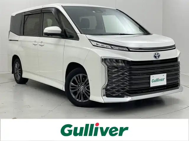 トヨタ ヴォクシー ハイブリッド S－G 茨城県 2022(令4)年 4.9万km ホワイトパールクリスタルシャイン 純正10.5型DAナビ/フルセグ/CD/DVDデッキ/HDMI/アドバンストパーク/全方位カメラ/14型フリップダウンモニター/衝突被害軽減ブレーキ/車線逸脱抑制装置/レーダークルーズコントロール/オートマチックハイビーム/クリアランスソナー/BSM/片側電動スライドドア/ETC2.0/ドラレコ/純正16インチAW/LEDヘッドライト/スマートキー