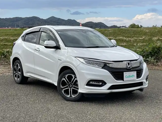ホンダ ヴェゼル ハイブリッド Z ホンダセンシング 新潟県 2018(平30)年 6.1万km プラチナホワイトパール 4WD/純正インターナビ(VXM-184VFi)/CD/DVD/BT/フルセグテレビ/バックカメラ/ETC/ドライブレコーダー/衝突被害軽減ブレーキ/レーンキープアシスト/レーダークルーズコントロール/半革シート/シートヒーター /パドルシフト/ステアリングスイッチ/スマートキー/プッシュスタート/LEDヘッドライト/オートライト/フォグランプ/純正17インチアルミホイール