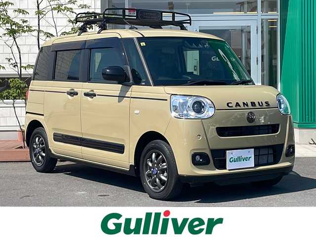 ダイハツ ムーヴ キャンバス セオリー G 青森県 2022(令4)年 1.4万km サンドベージュメタリック 4WD/ビタースタイルプラスパッケージ/純正9インチディスプレイオーディオ・フルセグTV/BT/USB/HDMI/バックカメラ/両側パワースライドドア/前席シートヒーター/ワイヤレス充電機能/スマートアシスト/衝突軽減ブレーキ/レーンキープアシスト/アダプティブドライビングビーム/コーナーセンサー/前方ドライブレコーダー/保温機能カップホルダー/黒革調シートカバー/純正ルーフキャリア/純正ミニライト14インチアルミ/フルLEDヘッドライト/LEDフォグライト