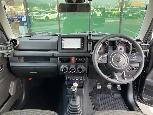 スズキ ジムニー シエラ JC 香川県 2025(令7)年 0.2万km ブルーイッシュブラックパール3 登録時走行距離：1505km/パナソニックナビ/　CD DVD BT フルセグTV/バックカメラ/クルーズコントロール/ダウンヒルアシストコントロール/衝突被害軽減装置/レーンキープアシスト/クリアランスソナー/LEDヘッドライト/オートライト/フォグランプ/ヘッドライトウォッシャー/横滑り防止装置/アイドリングストップ/シートヒーター/ビルトインETC/ドライブレコーダー/革巻きステアリング/ステアリングスイッチ/プッシュスタート/スマートキー