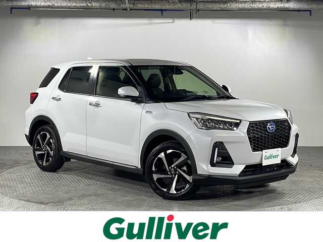 ダイハツ ロッキー プレミアム G HEV 沖縄県 2022(令4)年 1.2万km シャイニングホワイトパール 禁煙車　/県外仕入れ/スマートアシストIII/→衝突被害軽減システム/→後方コーナーセンサー/→車線逸脱警報/→オートマチックハイビーム/バックカメラ/レーダークルーズコントロール/ハーフレザーシート/シートヒーター/電動パーキングブレーキ/ステアリングリモコン/USBポート/LEDヘッドライト