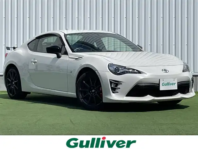 トヨタ ８６ GT リミテッド ブラックPKG 香川県 2019(令1)年 6.9万km クリスタルホワイトパール 登録時走行距離：68459km/純正7型ナビゲーション/→フルセグTV/→CD再生/バックカメラ/ETC/クルーズコントロール/ステアリングリモコン/革巻きステアリング/パドルシフト/プッシュスタート/シートヒーター/LEDオートライト/フォグランプ/横滑り防止機能/純正フロアマット/ハーフレザーシート/スマートキー