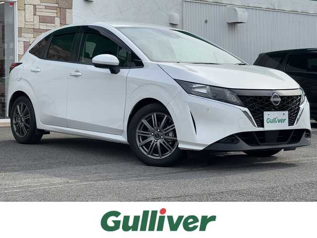日産 ノート X 徳島県 2021(令3)年 2.1万km ピュアホワイトパール ・純正９型ナビ/（フルセグＴＶ・ＢＴ・ＦＭＡＭ・ＣＤ・ＵＳＢ接続・ＳＤ・ｉｐｏｄ接続）/・ＥＴＣ　/・前後コーナーセンサー　/・オートマチックハイビーム　/・ステアリングリモコン　/・プロパイロット　/・衝突軽減ブレーキ
