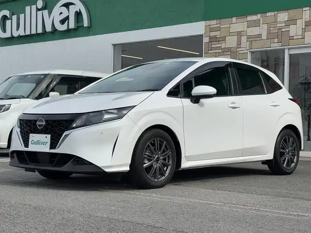 日産 ノート X 徳島県 2021(令3)年 2.1万km ピュアホワイトパール ・純正９型ナビ/（フルセグＴＶ・ＢＴ・ＦＭＡＭ・ＣＤ・ＵＳＢ接続・ＳＤ・ｉｐｏｄ接続）/・ＥＴＣ　/・前後コーナーセンサー　/・オートマチックハイビーム　/・ステアリングリモコン　/・プロパイロット　/・衝突軽減ブレーキ