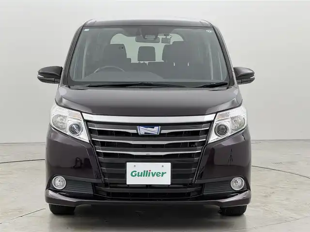 トヨタ ノア ハイブリッド G 福岡県 2016(平28)年 4.8万km ボルドーマイカメタリック 後席モニター　/純正８型ナビ（フルセグＴＶ）　/バックカメラ　/ビルトインＥＴＣ　/前方ドラレコ　/クルーズコントロール　/衝突軽減ブレーキ　/レーンキープ　/先行車発進　/片側電動スライドドア　/シートヒーター　/ＬＥＤ