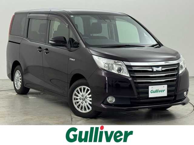 トヨタ ノア ハイブリッド G 福岡県 2016(平28)年 4.8万km ボルドーマイカメタリック 後席モニター　/純正８型ナビ（フルセグＴＶ）　/バックカメラ　/ビルトインＥＴＣ　/前方ドラレコ　/クルーズコントロール　/衝突軽減ブレーキ　/レーンキープ　/先行車発進　/片側電動スライドドア　/シートヒーター　/ＬＥＤ