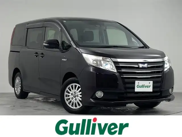 トヨタ ノア ハイブリッド G 熊本県 2016(平28)年 4.8万km ボルドーマイカメタリック 後席モニター　/純正８型ナビ（フルセグＴＶ）　/バックカメラ　/ビルトインＥＴＣ　/前方ドラレコ　/クルーズコントロール　/衝突軽減ブレーキ　/レーンキープ　/先行車発進　/片側電動スライドドア　/シートヒーター　/ＬＥＤ