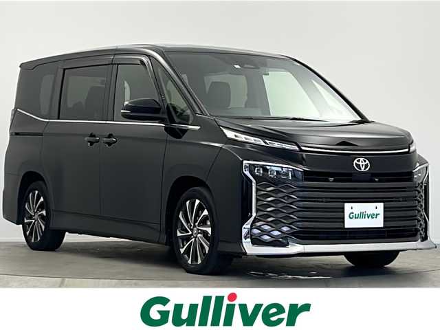 トヨタ ヴォクシー S－Z 大阪府 2022(令4)年 3.9万km アティチュードブラックマイカ ワンオーナー/10.5型ディスプレイオーディオ(フルセグＴＶ　ＡＭ　ＦＭ　ＢＴ　ＣＤ　ＤＶＤ　Ｍｉｒａｃａｓｔ　ＨＤＭＩ　Ａｐｐｌｅｃａｒｐｌａｙ）/サブウーファー(TS-WX130DA)/バックカメラ/前後ドライブレコーダー/ETC/クルーズコントロール追従機能付き/衝突軽減ブレーキ/横滑り防止装置/オートライト/オートマチックハイビーム/コーナーセンサー/パーキングアシスト/WAC/シートヒーター/ハーフレザーシート/両側パワースライドドア/パワーバックドア/純正フロアマット/純正AW