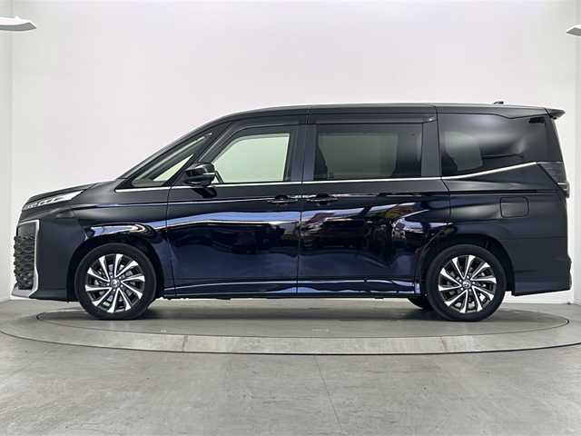 トヨタ ヴォクシー S－Z 大阪府 2022(令4)年 3.9万km アティチュードブラックマイカ ワンオーナー/10.5型ディスプレイオーディオ(フルセグＴＶ　ＡＭ　ＦＭ　ＢＴ　ＣＤ　ＤＶＤ　Ｍｉｒａｃａｓｔ　ＨＤＭＩ　Ａｐｐｌｅｃａｒｐｌａｙ）/サブウーファー(TS-WX130DA)/バックカメラ/前後ドライブレコーダー/ETC/クルーズコントロール追従機能付き/衝突軽減ブレーキ/横滑り防止装置/オートライト/オートマチックハイビーム/コーナーセンサー/パーキングアシスト/WAC/シートヒーター/ハーフレザーシート/両側パワースライドドア/パワーバックドア/純正フロアマット/純正AW