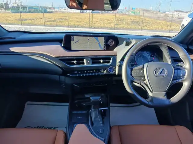 レクサス ＵＸ 250h ブラウンエディション 富山県 2020(令2)年 4.6万km グラファイトブラックガラスフレーク 純正10.3型ナビ/フルセグTV/ハンズフリーパワーバックドア/パノラミックビューモニター/ビルトインETC2.0/ドライブレコーダー/レーダークルーズコントロール/クリアランスソナー/セーフティシステムプラス/・プリクラッシュセーフティ/・レーントレーシングアシスト/・オートマチックハイビーム/・先行車発進告知機能/・ロードサインアシスト/ブラインドスポットモニター/パーキングサポートブレーキ/LEDヘッドランプ/革巻きステアリング/ステアリングヒーター/ブラウン合皮シート/前席パワーシート/シートヒーター/純正17インチアルミホイール/スマートエントリー/スタートシステム/禁煙車