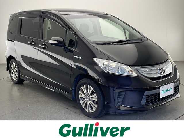 ホンダ フリード ハイブリット ジャストセレクション 宮崎県 2013(平25)年 9.8万km パープル 禁煙車/社外メモリーナビ/CD DVD フルセグTV/バックカメラ/クルーズコントロール/両側パワースライドドア/革巻きステアリング/黒ハーフレザー調シート/スマートキー/電動格納ミラー/オートライト/ETC/純正アルミホイール/カラーコード　パシフィックブルーパールPB６８P