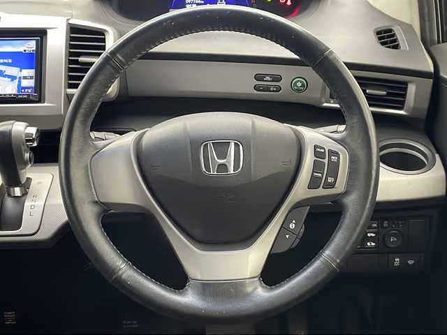 ホンダ フリード ハイブリット ジャストセレクション 宮崎県 2013(平25)年 9.8万km パープル 禁煙車/社外メモリーナビ/CD DVD フルセグTV/バックカメラ/クルーズコントロール/両側パワースライドドア/革巻きステアリング/黒ハーフレザー調シート/スマートキー/電動格納ミラー/オートライト/ETC/純正アルミホイール/カラーコード　パシフィックブルーパールPB６８P