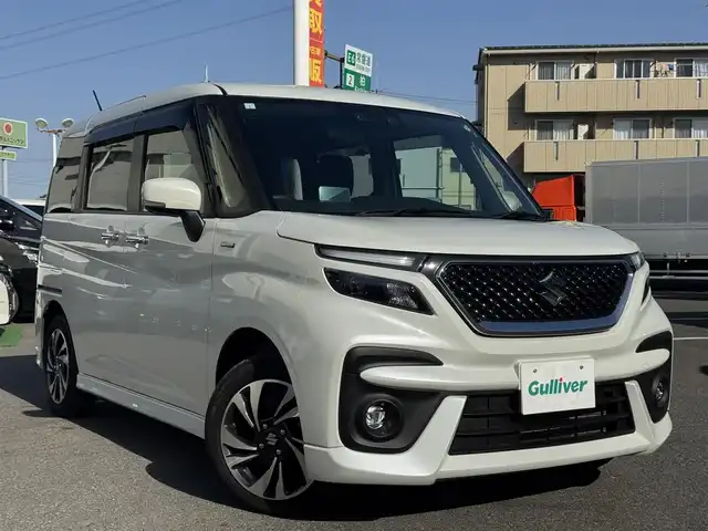 スズキ ソリオ バンディット HV MV 千葉県 2021(令3)年 1.3万km ピュアホワイトP デュアルブレーキサポートシステム/衝突軽減ブレーキ/レーダークルーズコントロール/レーンキープアシスト/コーナーセンサー/純正8インチナビ/フルセグTV/Bluetooth/バックカメラ/両側電動スライドドア/シートヒーター/アイドリングストップ/純正15インチAW/LEDライト/スマートキー/保証書・取説