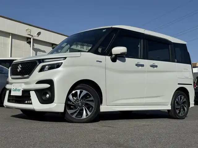 スズキ ソリオ バンディット HV MV 千葉県 2021(令3)年 1.3万km ピュアホワイトP デュアルブレーキサポートシステム/衝突軽減ブレーキ/レーダークルーズコントロール/レーンキープアシスト/コーナーセンサー/純正8インチナビ/フルセグTV/Bluetooth/バックカメラ/両側電動スライドドア/シートヒーター/アイドリングストップ/純正15インチAW/LEDライト/スマートキー/保証書・取説