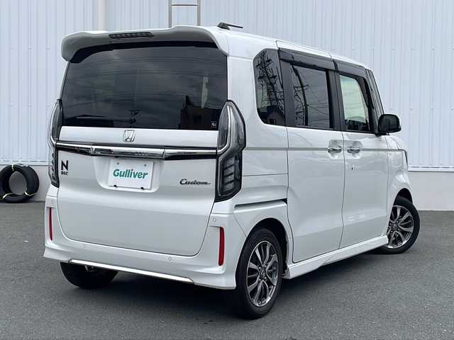 ホンダ Ｎ ＢＯＸ カスタム L 三重県 2021(令3)年 4.9万km プラチナホワイトパール プッシュスタート/電動格納ミラー/片側電動ドア/レーンキープアシスト/ETC/衝突軽減ブレーキ/レーダークルーズコントロール/ステアリングスイッチ/横滑り防止/コーナーセンサー/シートヒーター(前席)/オートライト/arrozzeria8型ナビ(AM/FM/CD/DVD/TV/BT)/フルセグTV/バックカメラ/USB入力端子2か所/リアサンシェード/スペアキー/純正フロアマット/禁煙車